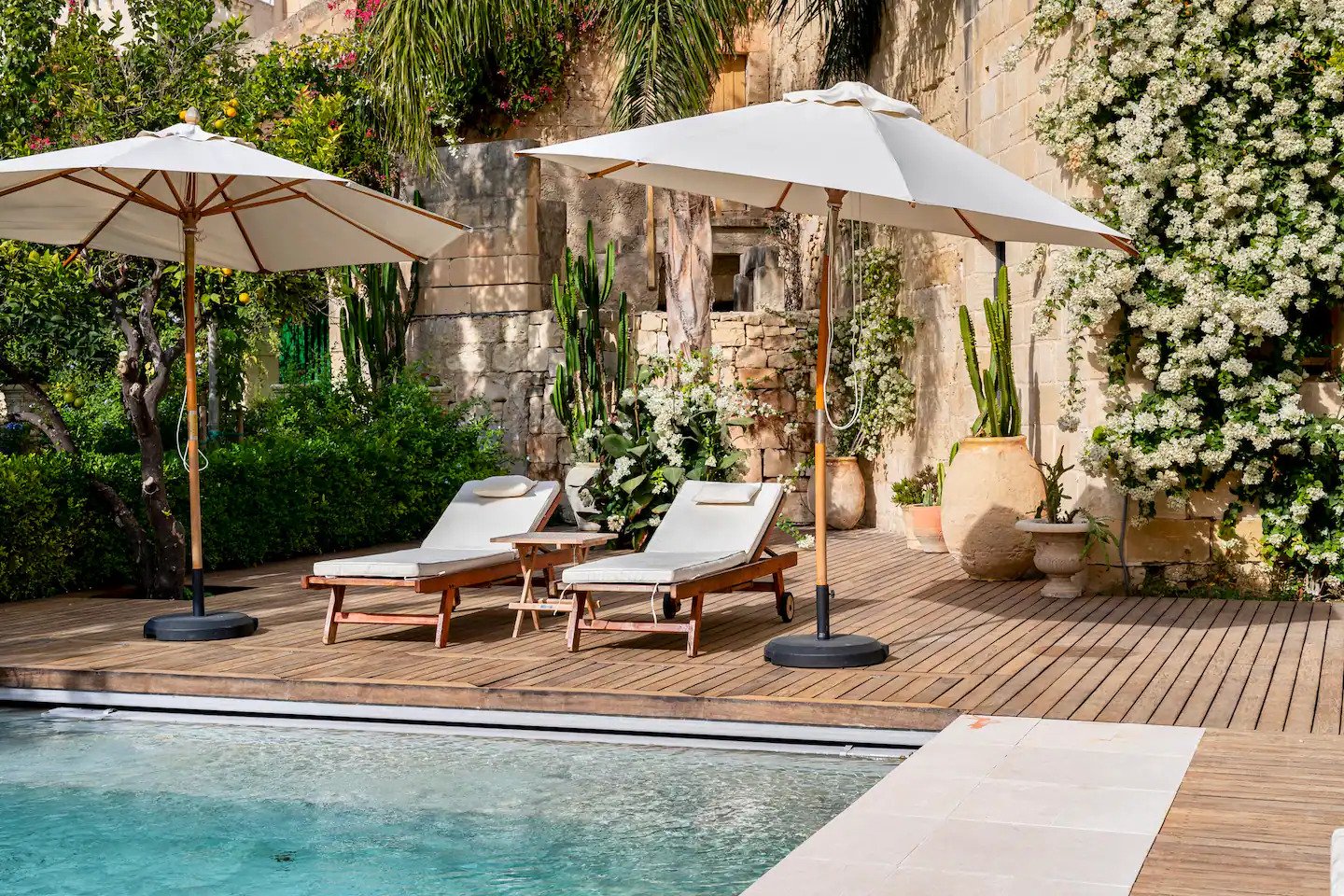 Sun loungers beside the secluded swimming pool